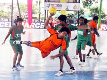 A moment of the match of the Walton LED Television First Division Handball League between Flame Boys Club and Jatrabari Sports Academy at the Shaheed (Captain) M Mansur Ali National Handball Stadium on Monday.