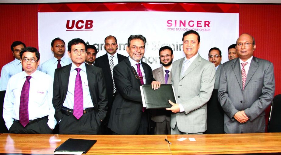 Muhammed Ali, Managing Director of United Commercial Bank and AM Hamim Rahmatullah, Managing Director of Singer Bangladesh Ltd, sign an agreement at its Corporate Head Office on Tuesday. UCB Credit Card holders will be able to buy Multi Brand Products fro