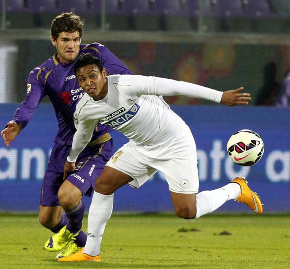 Fiorentina's Marcos Alonso (left) and Udinese's Luis Muriel vie for the ball during a Serie A soccer match at the Artemio Franchi stadium in Florence, Italy on Wednesday.