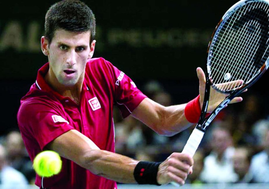 Serbia's Novak Djokovic returns the ball to Gael Monfils of France after their third round match at the ATP World Tour Masters tennis tournament at Bercy stadium in Paris, France on Thursday.