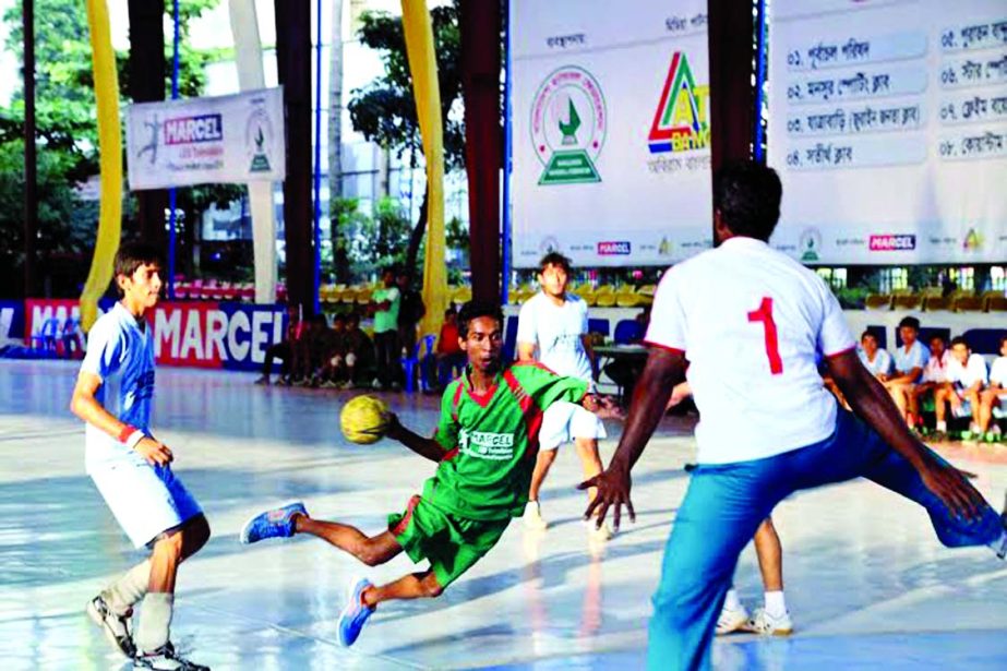 A scene from the match of the Marcel LED Television First Division Handball League between Star Sports and Jatrabari Sports Academy at the Shaheed (Captain) M Mansur Ali National Handball Stadium on Friday.