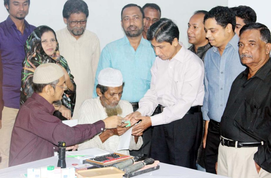 CDA Chairman Abdus Salam distributing medicine at an eye camp organised by Mabia Rashidia Foundation recently.