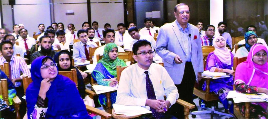 Dr M Mosharraf Hossain, Chairman and Managing Director of Rapport Bangladesh Limited poses with the participants of a training session on 'Leadership' for newly recruited officers of Al-Arafah Islami Bank Limited at the bank's training and research ac