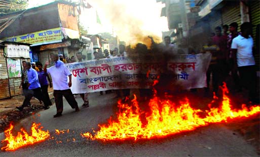 Jamaat-Shibir activists set fire on the street at Mirpur area by pouring petrol during hartal hours protesting ICT verdict on Jamaat Chief Matiur Rahman Nizami.