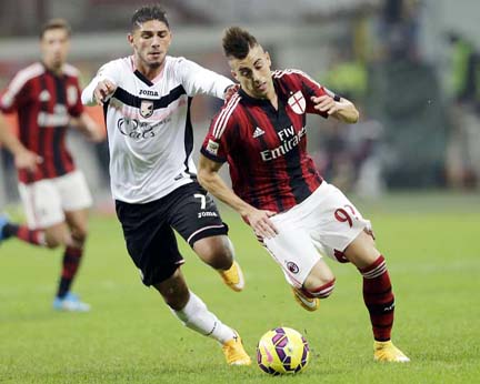 AC Milan's Stephan El Shaarawy (right) challenges for the ball with Palermoâ€™s Achraf Lazaar during the Serie A soccer match between AC Milan and Palermo at the San Siro stadium in Milan, Italy on Sunday.