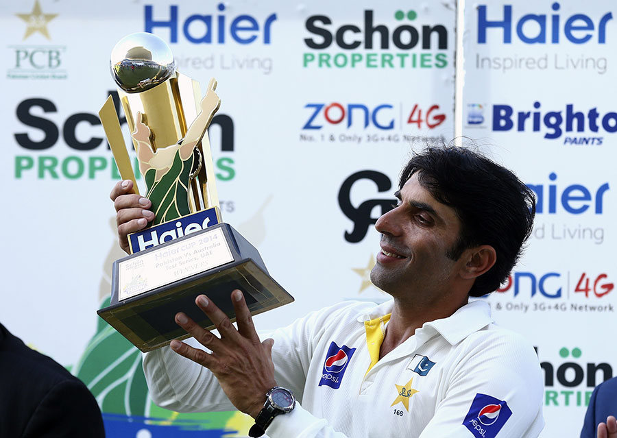 A smiling Misbah-ul-Haq lifts the trophy after Pakistan wrapped up the Test series 2-0 against Australia at Abu Dhabi on Monday.