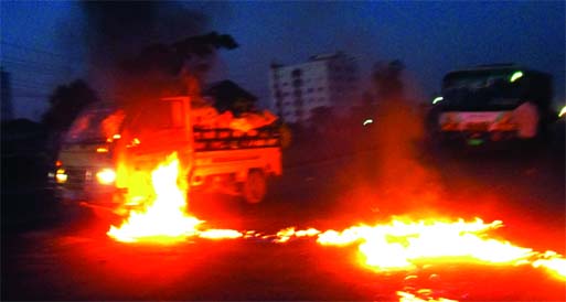 Jamaat-Shibir pickets trying to torch a goods-laden pick up van and set fire on the street by pouring petrol in Shanir Akhra area on Monday morning in support of hartal.