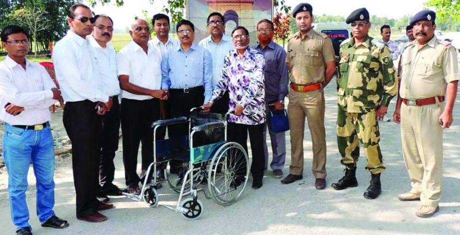 RANGPUR: Rangput Chamber of Commerce and Industry handing over wheel chair to the Burimari and Chengrabandha ICP authorities to ease movements of the ailing passengers on Tuesday.