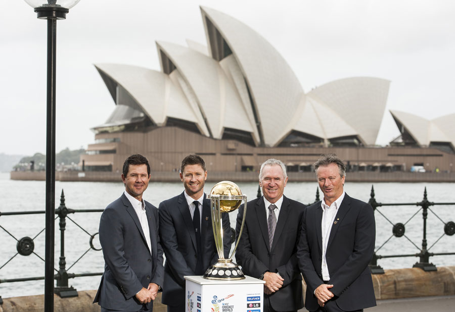 Ricky Ponting, Michael Clarke, Allan Border and Steve Waugh pose for photo with the World Cup trophy at Sydney on Thursday.