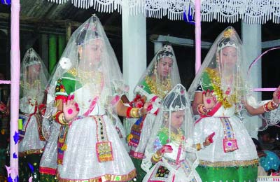 CHUNARUGHAT( Habiganj): Artists rendering Monipuri dance at a Chunarughat village on the occasion of Rash utshab on Thursday.