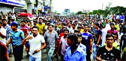 Port city Gate area truck drivers and transport workers on Saturday blocked the Dhaka-Chittagong highway protesting assault on a driver by a police sergeant for a toll of Taka 100 only.