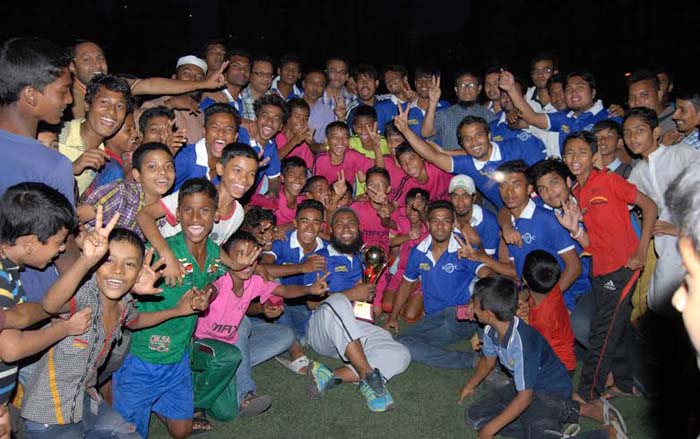 Arambagh Football Academy, the champions of the First Max Under-10 & 12 Football Festival with the officials of Sonali Otit Club and guests pose for a photo session at the BFF Artificial Turf on Sunday.