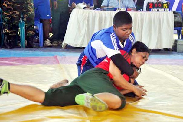 A scene from the Walton Mobile 5th Services Wrestling Competition at the Kabaddi Stadium adjoining Paltan ground on Monday.