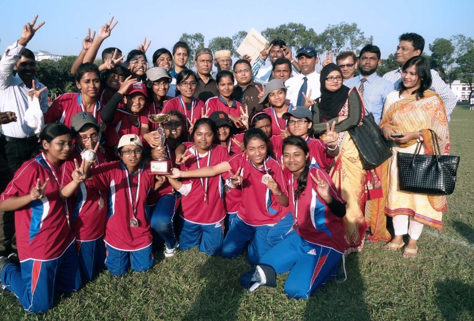 Members of Milestone College women cricket team celebrate with the championship trophy beating Mirza Abbas Womenâ€™s Degree College team in the Dhaka Board Inter College Cricket final at Dhaka Residential Model College playground on Monday.