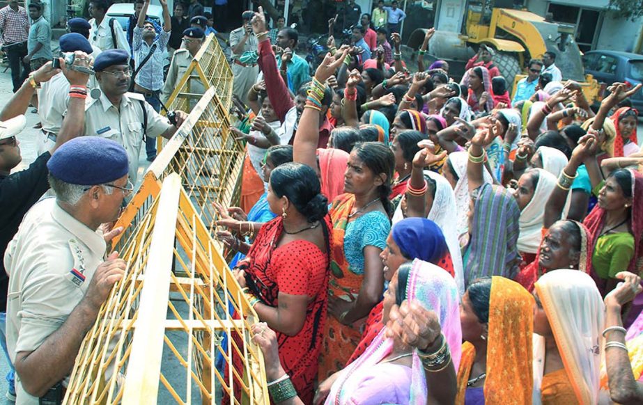 Villagers protesting at out side the state health ministers residence against death of women who underwent sterilization surgeries in Bilaspur, Chhattisgarh.