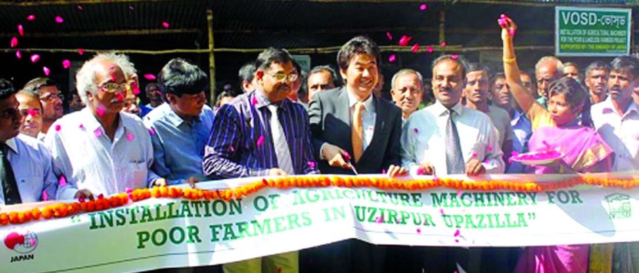 Takahiro Komatsu, Second Secretary of Japan Embassy, Md Shahidul Alam, Deputy Commissioner of Barisal District and AM Saidur Rahman, Chairman of VOSD inaugurating the Installation of Agricultural Machinery for the Poor and Landless Farmers at VOSD hall r
