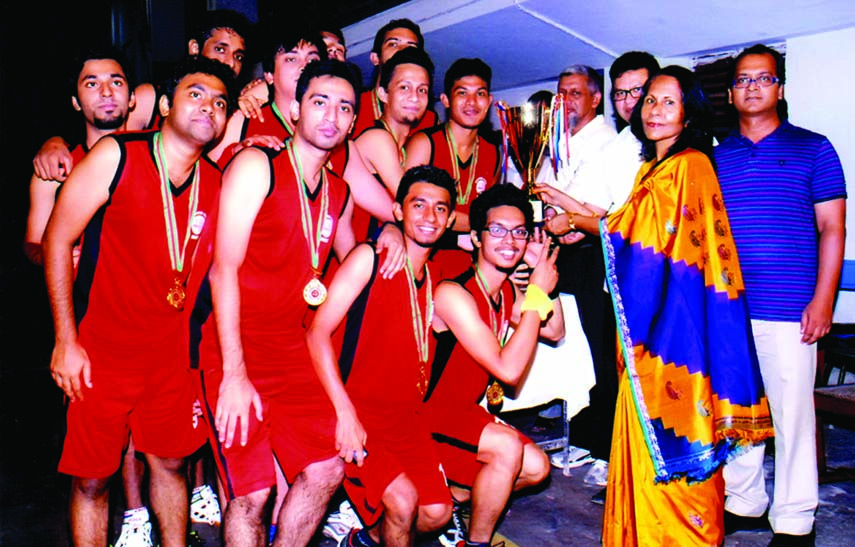 Prof. Khaleda Ekram, Vice-Chancellor of BUET handing over championship trophy of BUET Inter Hall Basketball competition 2014 to the team leader of Titumir Hall on Tuesday at the University gymnasium. Titumir Hall became champions beating Shahid Smrity Hal