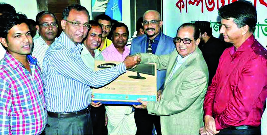 State Minister for Youth and Sports Biren Sikder, MP handing over computer to General Secretary of Narail District Sports Association Ashiqur Rahman Miku at the conference room of the National Sports Council on Wednesday. Deputy Minister for Youth and Spo