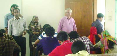 MYMENSINGH: Prof Dr Mohit -Ul- Alam visiting a examination hall of honours admission test of Kobi Nazrul Islam University, Mymensingh on Tuesday. Among others Dr Md Abdul Basar, Treasurer and Dr Subroto Kumar De, Dean, Business Administration were presen