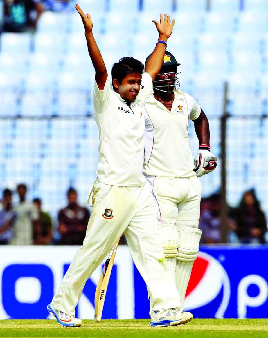 Bangladesh cricketer Jubair Hossain (L) reacts after taking five wickets on the third day.