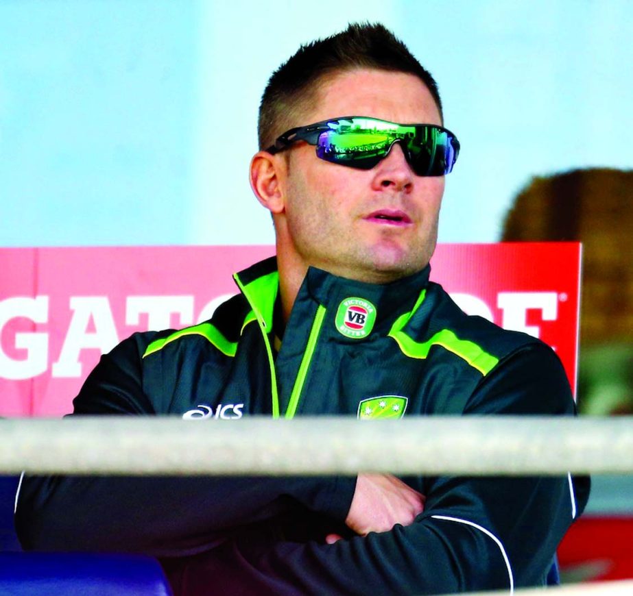 Michael Clarke watches from the dressing room after hurting his hamstring during the 1st ODI between Australia and South Africa, Perth on Friday.