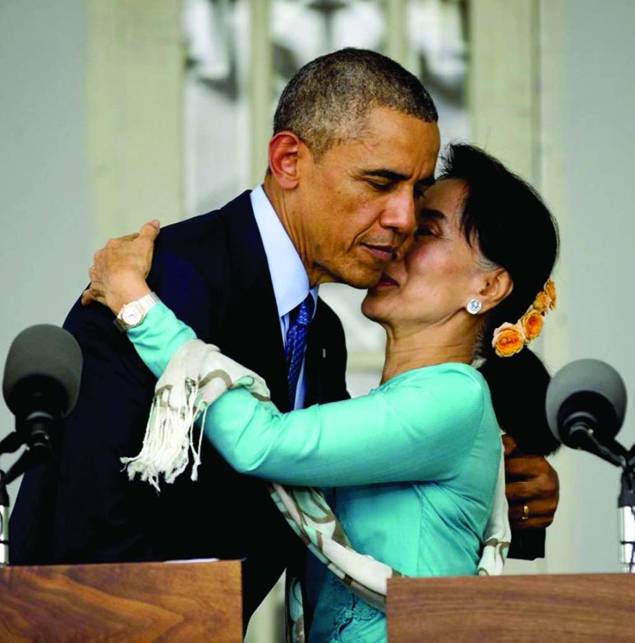 US President Barack Obama and Myanmar's opposition leader Aung San Suu Kyi embrace during a news conference at her home in Yangon on Friday.