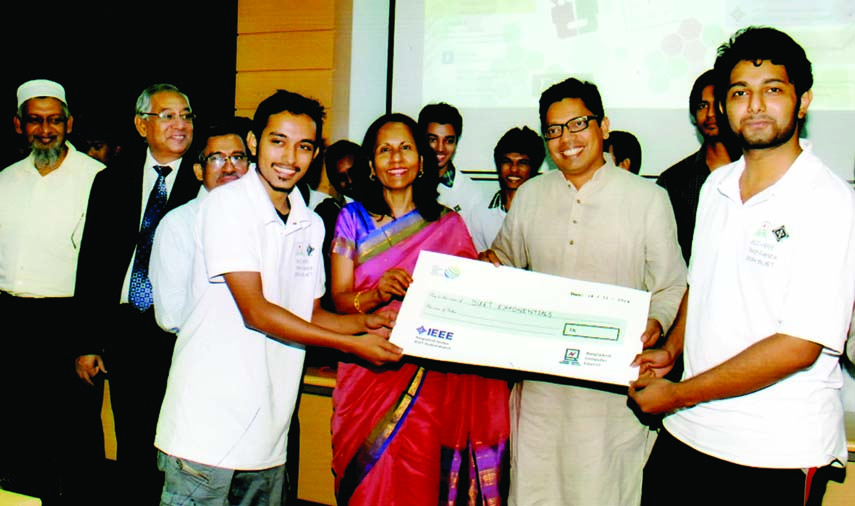 Zunaid Ahmed Palak, State Minister for Information and Communication Technology handing over a prize money to the team leader of BUET Exponentials for achieving 1st position in the competition of final round International Robotics Challenge (IRC)-2014 on