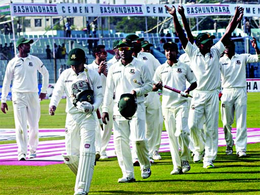 Tigers walk back after a 186-run win against Zimbabwe at the Zahur Ahmed Chowdhury Stadium in Chittagong on Sunday.