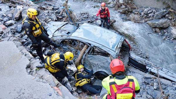 Rescuers work near the area where a landslide in the village of Davesco-Soragno near Lugano Switzerland on Sunday.