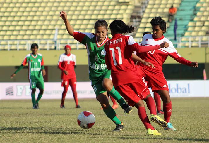 An action from the match of 3rd SAFF Women's Football Championship 2014 between Bangladesh and Maldives at the Jinnah Football Stadium in Islamabad, Pakistan on Monday.
