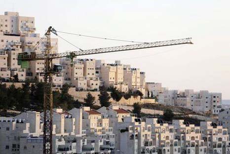 Reuters file photo shows a crane is seen next to homes in a Jewish settlement known to Israelis as Har Homa and to Palestinians as Jabal Abu Ghneim, in an area of the West Bank that Israel captured in a 1967 war and annexed to the city of Jerusalem.