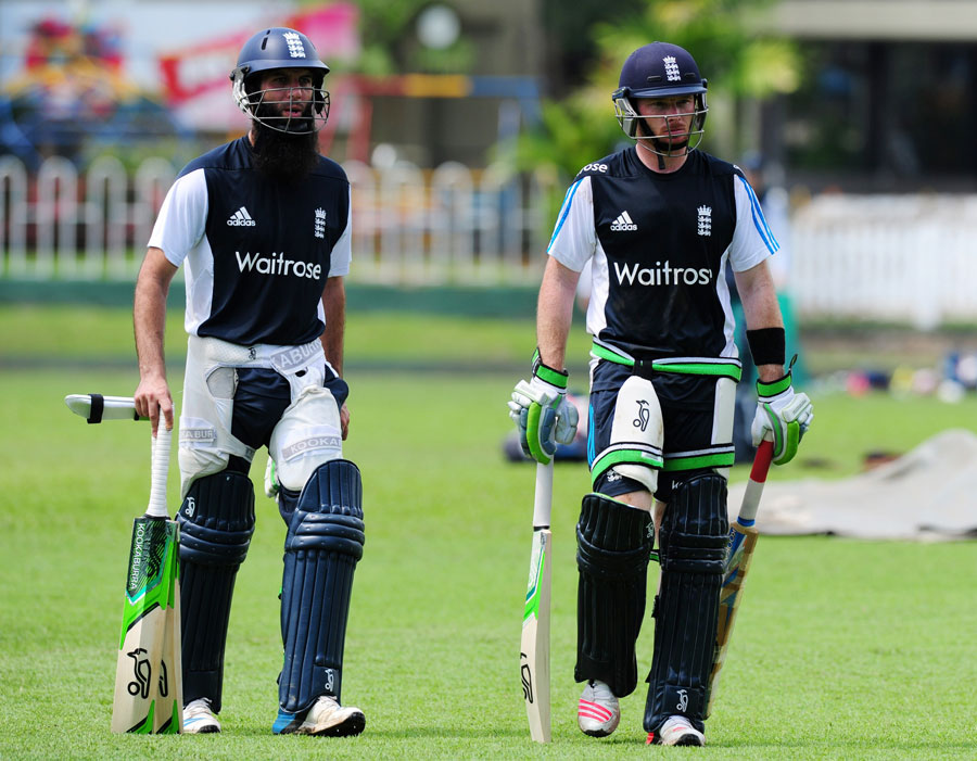 Moeen Ali (left) and Ian Bell head for the nets at Colombo on Thursday.