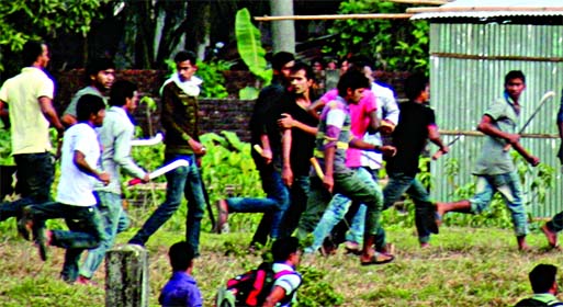 Two groups of BCL activists chasing each other with lethal weapons during a clash at the premises of SUST on Thursday.