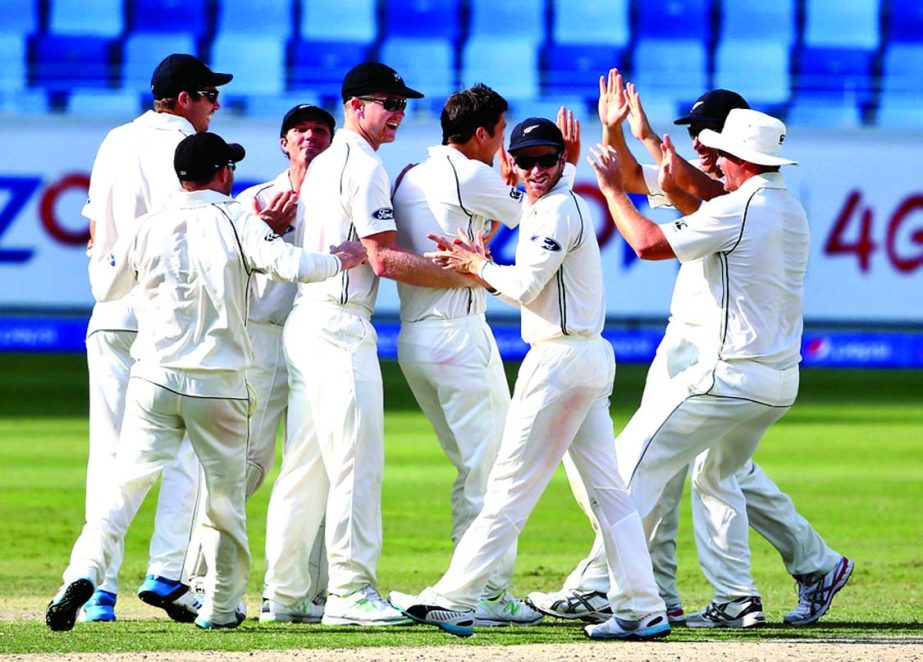 New Zealand get together after Trent Boult had Misbah-ul-Haq out for a duck on the 5th day of 2nd Test between Pakistan and New Zealand at Dubai on Friday.