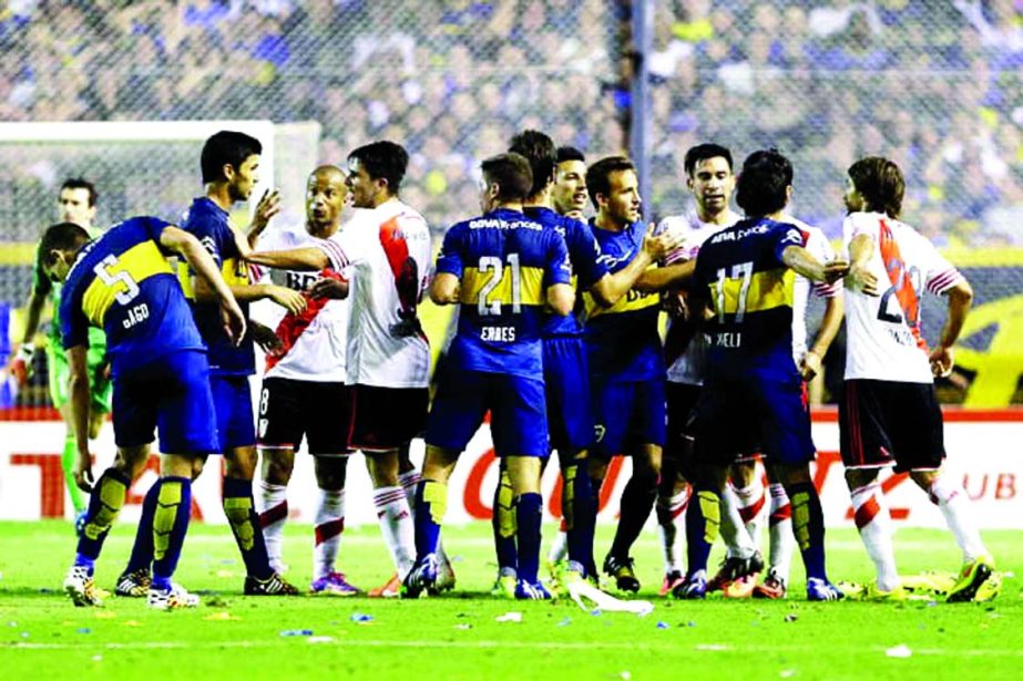 River Plate and Boca Juniors players scuffle during the first leg of the Copa Sudamericana semifinal soccer match in Buenos Aires, Argentina on Thursday.