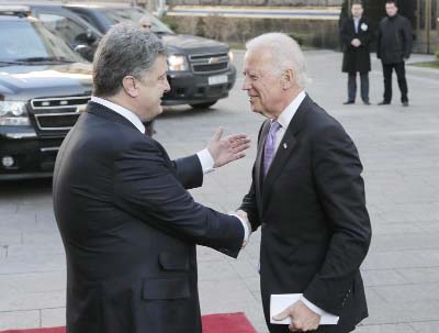 Ukrainian President Petro Poroshenko, left, shakes hands with U.S. Vice President Joe Biden during a meeting in Kiev, Ukraine on Friday.