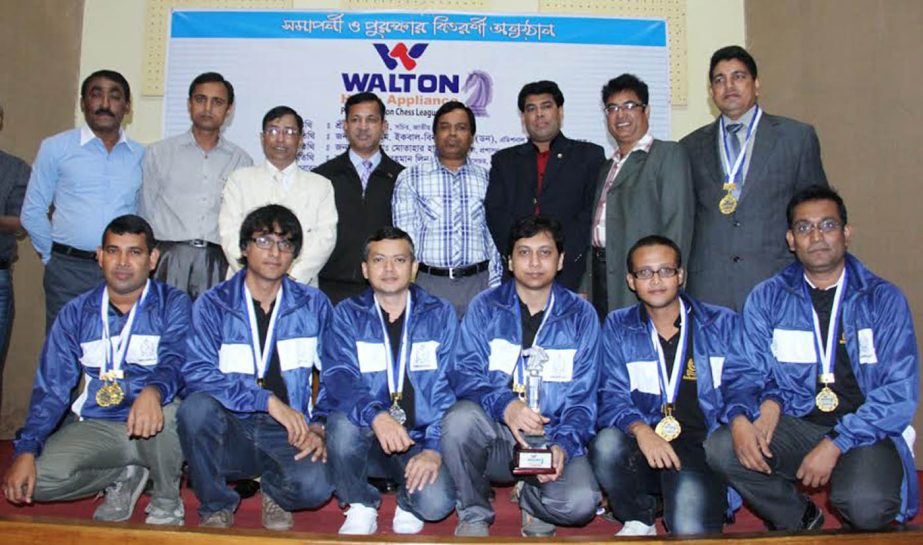 The winners of the Walton Home Appliance Premier Division Chess League with the guests and the officials of Bangladesh Chess Federation pose for a photograph at the Dutch-Bangla Bank Auditorium of Bangladesh Olympic Association Bhaban on Saturday.