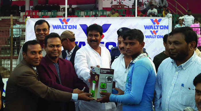 Shariful of Ashashuni Upazila team receiving the Man of the Match award from Additional DC of Satkhira district and President of the Tournament Committee Md Mohsin Ali at the Satkhira District Stadium on Saturday.