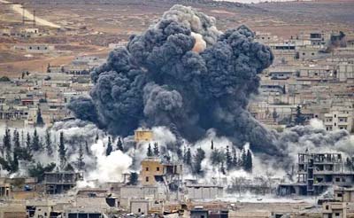 AP file photo shows smoke rises from the Syrian city of Kobani, following an airstrike by US-led forces.
