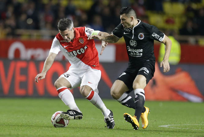 Monacoâ€™s Jeremy Toulalan (left) challenges for the ball with Caenâ€™s Mathieu Duhamel during the French League One soccer match between Monaco and Caen in Monaco stadium on Saturday.