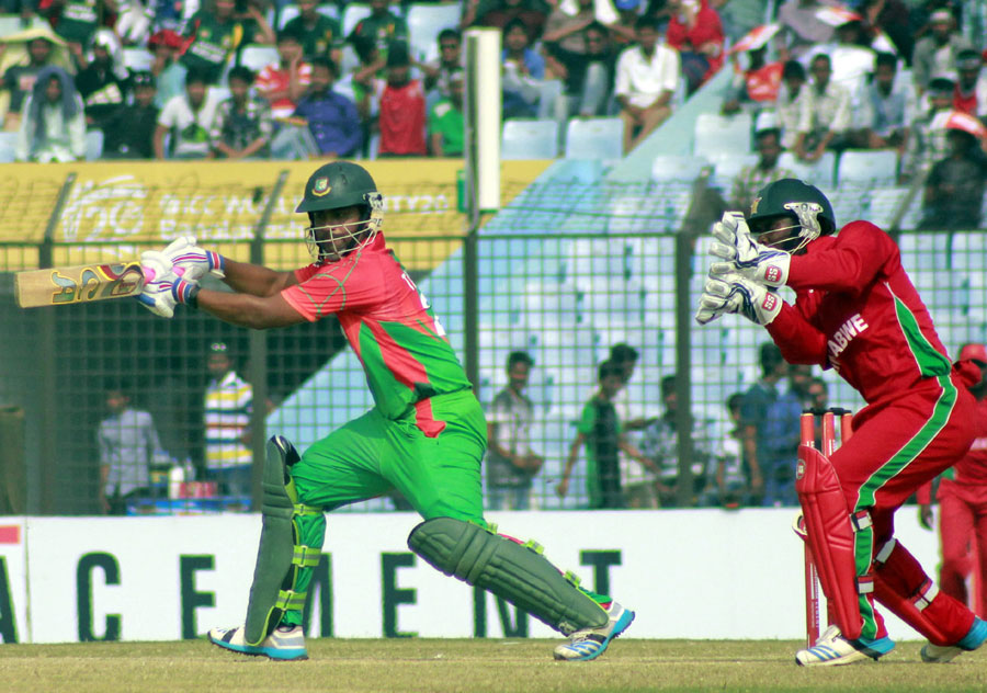 Tamim Iqbal drives through the offside during the 2nd ODI between Bangladesh and Zimbabwe at Chittagong on Sunday. Bangladesh won by 68 runs.