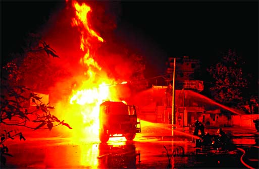 An oil tanker caught fire while releasing fuel oil at a filling station in city's Tajgaon on Sunday evening.