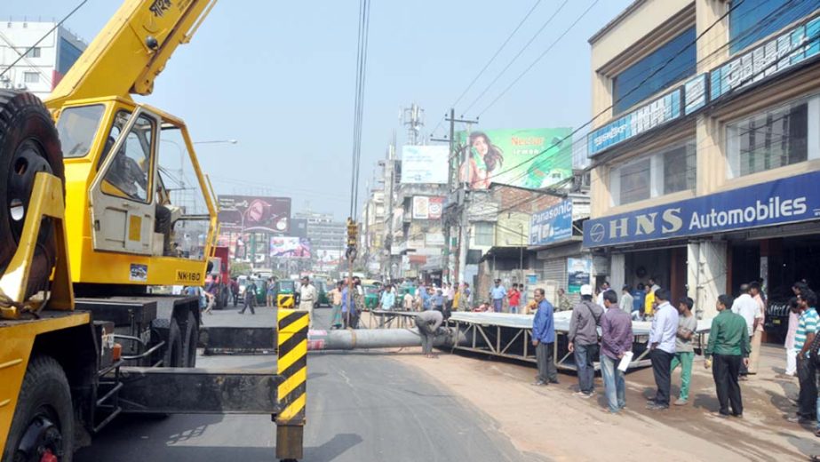 Illegal bill boards are being removed from Chowmohoni area in Chittagong city yesterday.