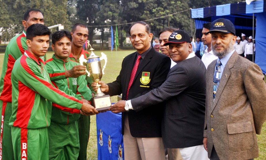 Chief of Air Staff Air Marshal Muhammad Enamul Bari giving away championship trophy to BAF Base Bashar team who won the title of BAF Inter Base Athletics Competition at BAF Base Bangabandhu Sports ground, Dhaka Cantonment on Monday. ISPR photo