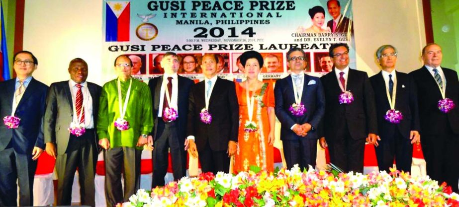 Bangladesh Bank Governor Dr Atiur Rahman poses with other laureates of "Gusi Peace Prize International 2014" at Chinese General Hospital Auditorium, Manila, Philippines on Monday.