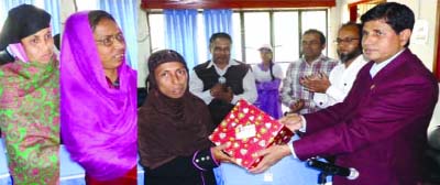 NETRAKONA: Deputy Commissioner Dr. Torun Kanti Shikder distributing prizes at DC's conference room among three best farmers of the district for their contributions in achieving food security on Monday.