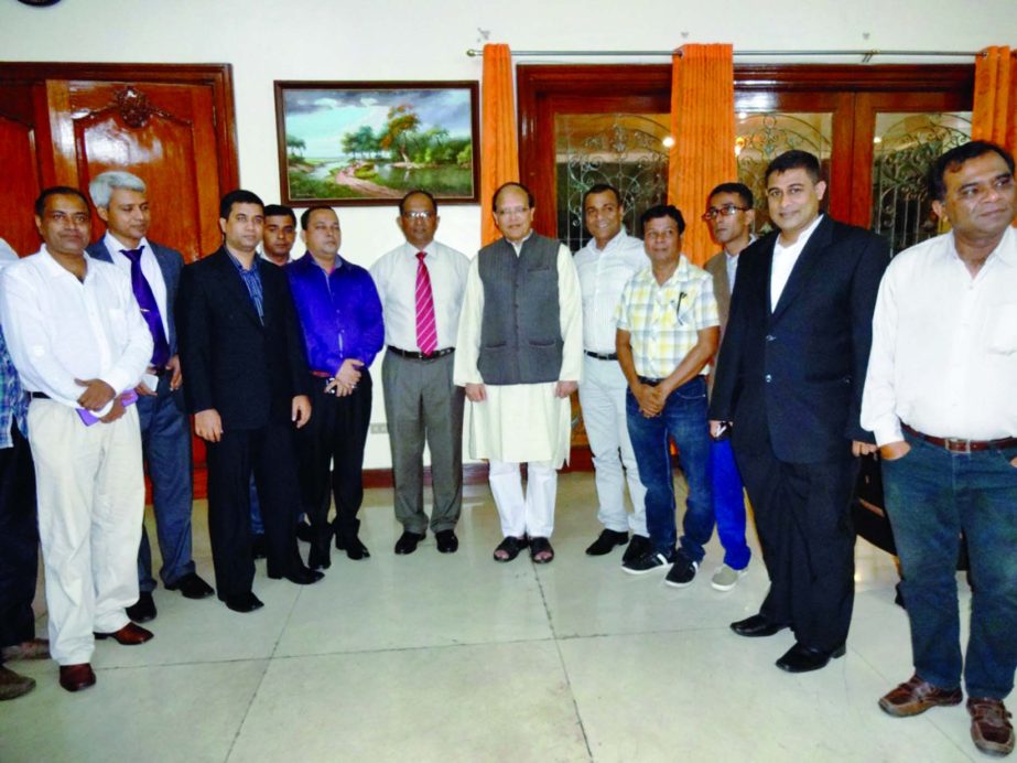 Non-Resident Bangladeshis (NRBs) of Philippines pose with Bangladesh Bank Governor Dr Atiur Rahman at the residence of Bangladesh Ambassador in Manila on Tuesday.