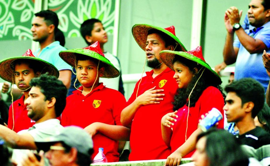 Cricket fans wearing colourful dress enjoying 4th ODI match between Bangladesh and Zimbabwe at the Sher-e Bangla National Stadium in Dhaka on Friday.