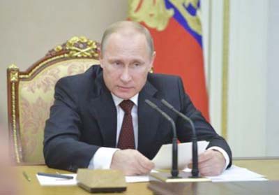 Russian President Vladimir Putin chairs a meeting of the Security Council at the Kremlin in Moscow.