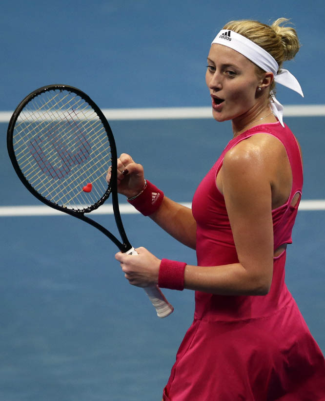 Kristina Mladenovic of the UAE Royals celebrates after getting a point during her women's singles match against Daniela Hantuchova of the Singapore Slammers in the International Premier Tennis League at the Mall of Asia Arena in Pasay city, south of Man